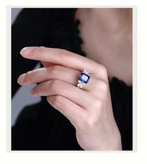 "Fashionable Personality Square Ring, S925 Silver Plated with 18K Gold, European and American Retro Simulated Sapphire Engagement Ring." Main Stone:9*11mm. Main Stone Material: Cultivated Sapphire. Secondary Stone Material:5A Zircon